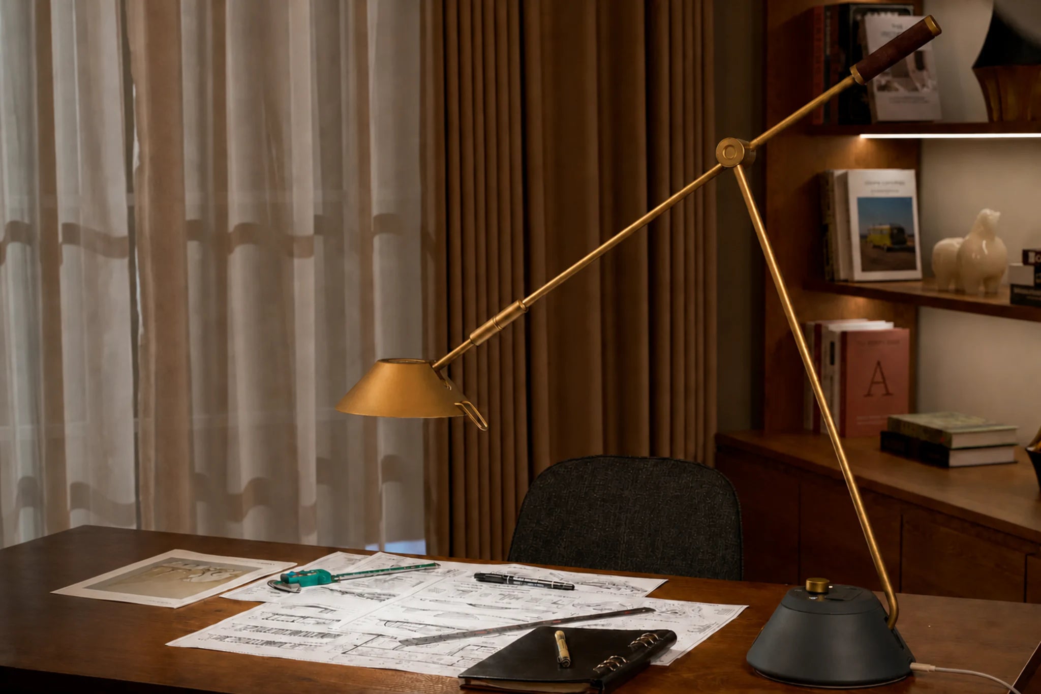 SOLA Desk showing its lamp head, long arm, pivot joint and weighted base
