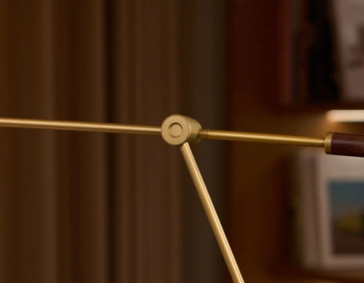 Close view of SOLA Desk’s damped pivot and copper-finished arm